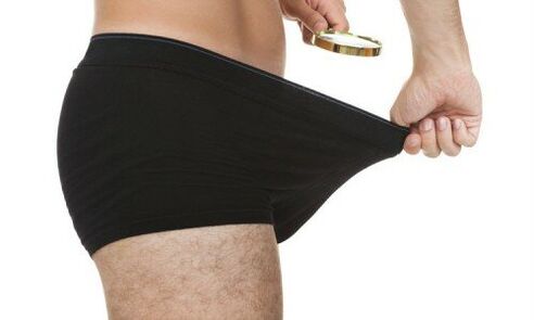 a man looks at shorts before a penis enlargement pump